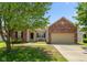 Charming single-Gathering home featuring a brick facade, attached garage, and a well-maintained front yard at 10725 Tedder Lake Dr, Indianapolis, IN 46239