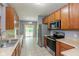 Updated Kitchen boasts stainless appliances and easy access to patio for outdoor dining at 10725 Tedder Lake Dr, Indianapolis, IN 46239