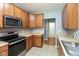 Updated kitchen boasts stainless steel appliances, lots of storage and modern finishes at 10725 Tedder Lake Dr, Indianapolis, IN 46239