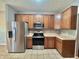 Well-equipped kitchen with stainless appliances and neutral countertops at 10725 Tedder Lake Dr, Indianapolis, IN 46239