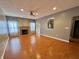 Spacious living room with fireplace, recessed lighting, and wood flooring at 10725 Tedder Lake Dr, Indianapolis, IN 46239