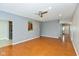 Spacious living room featuring wood floors and an open doorway leading to a kitchen and front door at 10725 Tedder Lake Dr, Indianapolis, IN 46239