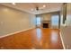 Open-concept living room featuring a fireplace and ceiling fan at 10725 Tedder Lake Dr, Indianapolis, IN 46239