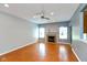 Spacious living room featuring a fireplace, ceiling fan, recessed lighting, and large windows at 10725 Tedder Lake Dr, Indianapolis, IN 46239