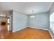 Bright living room boasts wood floors, neutral walls, and a cozy fireplace with a tiled surround at 10725 Tedder Lake Dr, Indianapolis, IN 46239