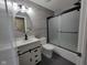 Bathroom featuring gray tile and a stand alone vanity at 11070 Long Lake Ln, Fishers, IN 46037