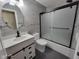 Bathroom featuring gray tile and a stand alone vanity at 11070 Long Lake Ln, Fishers, IN 46037
