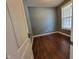 Bedroom featuring hardwood floors and a window with blinds at 11070 Long Lake Ln, Fishers, IN 46037