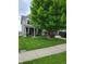 Charming home exterior featuring a well-manicured lawn and beautiful landscaping at 11070 Long Lake Ln, Fishers, IN 46037