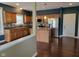 Modern kitchen featuring stainless steel appliances, hardwood floors, and an island with barstool seating at 11070 Long Lake Ln, Fishers, IN 46037