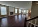 Spacious living room with hardwood floors, fireplace, and lots of natural light at 11070 Long Lake Ln, Fishers, IN 46037