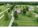 Stunning aerial view of a well-maintained home with a large yard and mature trees at 11198 N 650 W, Fountaintown, IN 46130