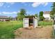 Fenced in backyard area with storage and outbuildings at 11198 N 650 W, Fountaintown, IN 46130