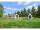 Fenced backyard with sheds and pens at 11198 N 650 W, Fountaintown, IN 46130