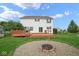 Backyard with spacious deck, fire pit, and well-maintained lawn perfect for outdoor activities at 11198 N 650 W, Fountaintown, IN 46130