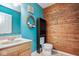 Charming bathroom with modern vanity and wood accent wall at 11198 N 650 W, Fountaintown, IN 46130