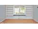 Bedroom with built-in shelving spanning the wall beneath a window providing natural light at 11198 N 650 W, Fountaintown, IN 46130