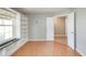 Bright bedroom featuring wood floors, built-in shelving, and ample natural light at 11198 N 650 W, Fountaintown, IN 46130
