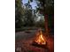 Cozy campfire by the river at night, perfect for relaxing outdoors at 11198 N 650 W, Fountaintown, IN 46130