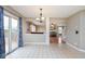 Inviting dining area with tile flooring, access to the deck, and views into the living room at 11198 N 650 W, Fountaintown, IN 46130