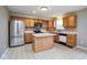Traditional kitchen with stainless steel refrigerator, island, and tiled backsplash at 11198 N 650 W, Fountaintown, IN 46130