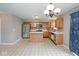 Eat-in kitchen featuring stainless steel refrigerator, kitchen island, and ample counter space at 11198 N 650 W, Fountaintown, IN 46130