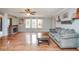 Open-concept living room features hardwood flooring, a fireplace, and cozy seating at 11198 N 650 W, Fountaintown, IN 46130