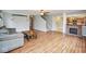 Inviting living room featuring wood floors, fireplace and staircase at 11198 N 650 W, Fountaintown, IN 46130