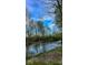 Scenic river view with lush trees and blue sky reflecting in the water at 11198 N 650 W, Fountaintown, IN 46130