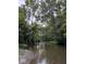 Calm river with a pebbly bank and lush trees offering shade at 11198 N 650 W, Fountaintown, IN 46130