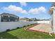 Spacious backyard with white fence, patio area, and lush green grass at 1221 Hamilton Dr, Greenwood, IN 46143