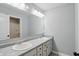 Bathroom featuring a double sink vanity and spacious mirror at 1221 Hamilton Dr, Greenwood, IN 46143