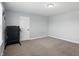 Neutral bedroom with a door and carpet flooring, offering a blank canvas for personalization at 1221 Hamilton Dr, Greenwood, IN 46143
