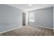 Bright bedroom with a window and carpet flooring, along with a closet at 1221 Hamilton Dr, Greenwood, IN 46143