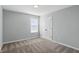 Neutral bedroom with a window and carpet flooring, offers a serene space at 1221 Hamilton Dr, Greenwood, IN 46143