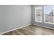 Bedroom with two bright windows and base molding, providing natural light and architectural detail at 1221 Hamilton Dr, Greenwood, IN 46143