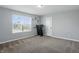 Comfortable bedroom with plush carpeting, plenty of light from the large window, and ample space for various uses at 1221 Hamilton Dr, Greenwood, IN 46143