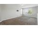 Spacious bonus room featuring neutral decor, ample natural light and pre-wiring for a wall-mounted television at 1221 Hamilton Dr, Greenwood, IN 46143