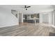 Open-concept living space with hardwood flooring and stylish gray cabinets at 1221 Hamilton Dr, Greenwood, IN 46143