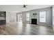 Bright living room featuring hardwood floors, a fireplace, and an open layout at 1221 Hamilton Dr, Greenwood, IN 46143