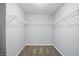 Spacious walk-in closet featuring neutral paint, plush carpeting, and ample shelving for easy organization at 1221 Hamilton Dr, Greenwood, IN 46143