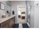 This bathroom features double sinks and a view of an adjacent main bedroom at 1227 Highbury Dr, Danville, IN 46122