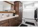 This bathroom features a single sink, wood cabinets, and a bathtub with a shower at 1227 Highbury Dr, Danville, IN 46122