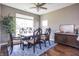 Elegant dining room with a large window, stylish furniture, and a beautiful area rug at 1227 Highbury Dr, Danville, IN 46122