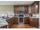 Well-equipped kitchen with stainless steel appliances and beautiful countertop at 1227 Highbury Dr, Danville, IN 46122