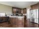Beautiful kitchen with dark wood cabinets, stainless steel appliances, and granite countertops at 1227 Highbury Dr, Danville, IN 46122