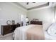 This main bedroom features a dresser and a doorway to an adjacent bathroom at 1227 Highbury Dr, Danville, IN 46122