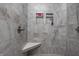 This shower features tile walls, a shower seat, and two built-in shelves at 1227 Highbury Dr, Danville, IN 46122