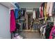 This walk-in closet features built-in shelving and hanging racks for clothing storage at 1227 Highbury Dr, Danville, IN 46122