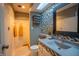 Modern bathroom with mosaic tile accent wall, updated fixtures, and ample vanity space at 131 Olde Mill Bay, Indianapolis, IN 46260